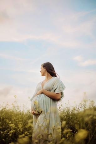 A serene outdoor maternity portrait capturing the calm, beauty, and anticipation of motherhood in natural light.